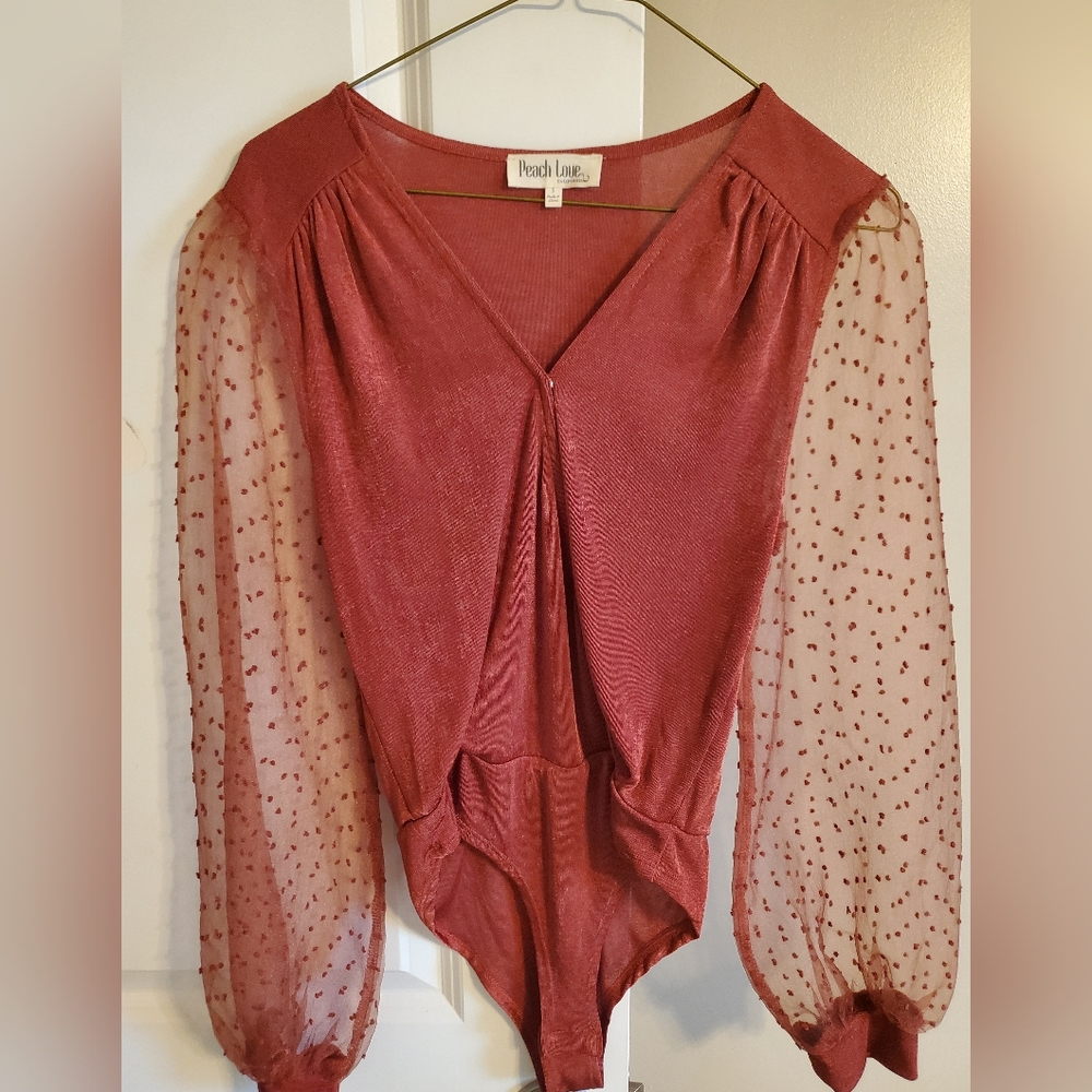 Boutique rust/ red body suit with sheer sleeves size small
